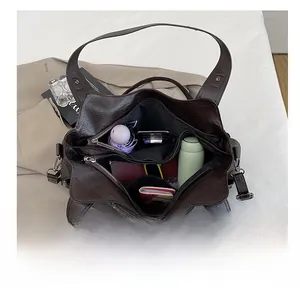 Top view of the spacious inner compartments of the retro brown tote bag for daily essentials