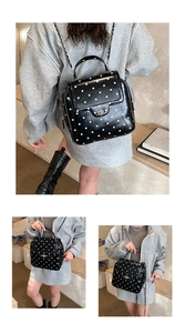 Polka dot backpack featuring glossy finish and silver metal chain strap for women
