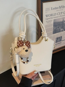 White lychee pattern bucket bag with bear charm and adjustable shoulder strap