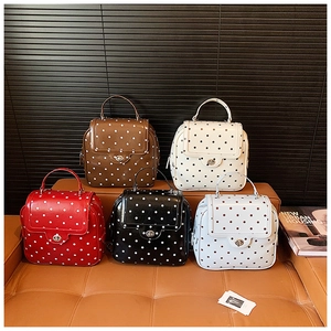 Polka dot pattern multi-functional mini backpacks with metallic turn-lock closure in five colors