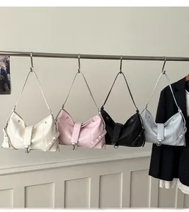 Detail view of stylish leather hobo shoulder bags in white pink black and blue colors