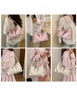 Detailed views of vintage hobo shoulder bags in pink and white with metal buckle straps