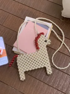 Handmade beaded crossbody bag in cute horse shape with white pearls and red accents