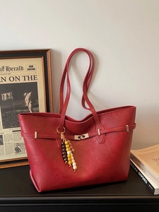 Large dark red vintage faux leather tote bag with lock buckle and beaded pendant