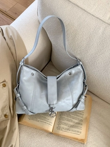 Elegant silver-grey hobo shoulder bag with matte leather finish and adjustable wide strap