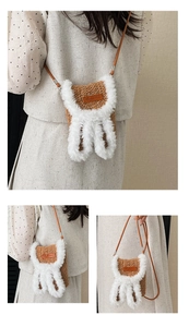 Detail of handmade plush rabbit ear crossbody bag with woven texture and brown strap
