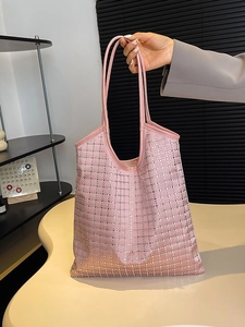 Pink satin tote bag with rhinestone grid pattern and long handles for shoulder wear