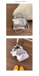 Detail view of cloud-shaped shoulder bags with floral embroidery and cute plush charms