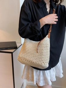 Chic cream crochet woven shoulder bag with brown leather strap for summer beach vacation