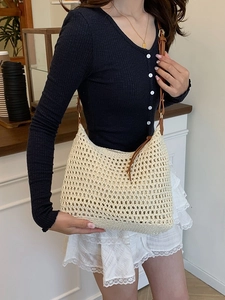 Cream crochet knit hobo bag with brown leather strap for summer beach holidays