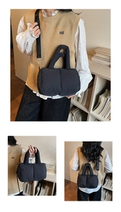 Detail view of the black quilted puffer tote bag with adjustable shoulder strap and handle