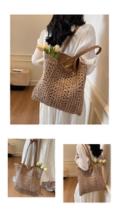 Detailed view of woven straw tote bag texture and brown leather strap reinforcement