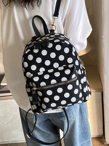 Zaino minimalista a grandi pois bianchi su tela nera per donna di grande capacità