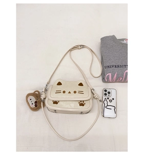 Detailed embroidery of cat face and paws on cream-white PU leather crossbody bag