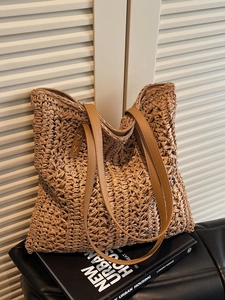 Minimalist woven straw tote bag with brown PU leather straps and zipper closure