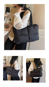Macro detail of black quilted puffer tote bag with spacious puffed shoulder straps