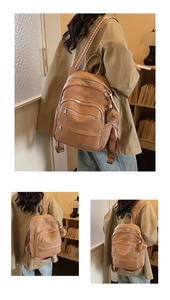 Detail of caramel brown PU leather backpack with geometric woven straps and plush charm