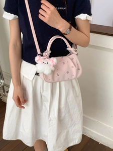 Pink dumpling shoulder bag with floral embroidery and white plush bear pendant