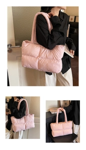 Detailed view of pink quilted puffer tote bag with soft texture and wide shoulder straps
