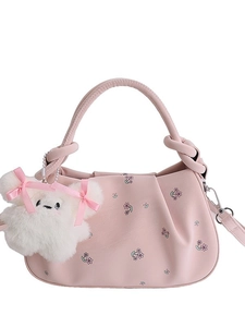Pink floral crossbody bag with pleated handle and cute bear charm decoration
