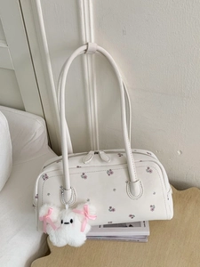 Large white underarm shoulder bag with floral print and plush star charm for commuting