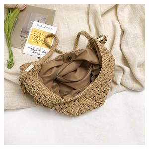 Detail of woven tote bag featuring soft inner lining, zipper pocket and magnetic closure