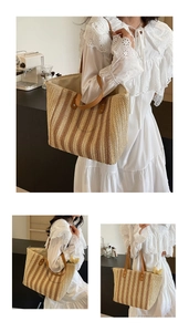 Detail of bohemian straw tote bag with vertical stripes and brown leather handles