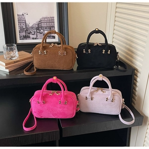 French vintage baguette shoulder bag in brown, black, magenta, and light purple suede