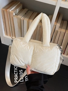 Quilted puffy hobo shoulder bag in cream white with adjustable wide nylon strap