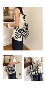 Close-up of handmade woven tote bag with black and white checkered pattern and long strap