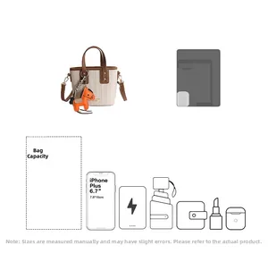 Detail view of cream canvas bucket bag showing capacity for phone and accessories