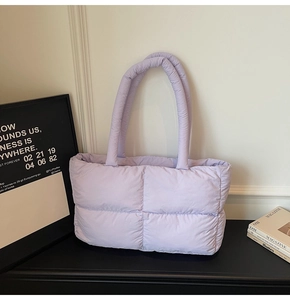 Close-up of lilac quilted puffer tote bag with soft padded handles and diamond texture