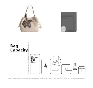Internal capacity of beige bucket bag showing phone, cosmetics and daily essentials