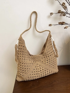 Handwoven khaki knit tote bag with bohemian hollow pattern and side fringe details
