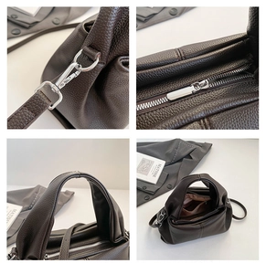 Detail of dark brown lychee leather handbag with silver hardware and shoulder strap