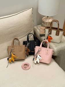 Trendy PU Leather Mini Bucket Bag For Women Retro Woven Texture Handbag With Horse Charm Commuter Crossbody Bag