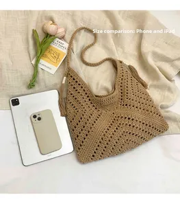 Detail view of woven beach tote showing fringe tassels and hollow knit texture vs iPad size