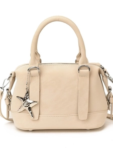 Creamy white PU leather bowling bag with silver star charm and adjustable shoulder strap