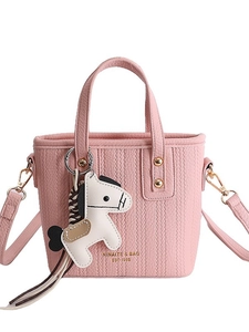 Pink woven leather bucket bag with top handle, crossbody strap and horse charm detail