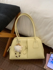 Creamy yellow underarm bag in soft PU leather with a cute creative crochet charm