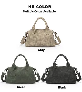 Three retro boston handbags in grey, green and black with textured matte leather details