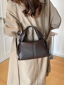 Dark brown lychee texture leather cloud tote bag with rounded handles and shoulder strap