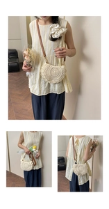 Detail of hollow woven cream crossbody bag with brown leather strap and shell shape