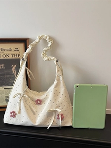 Sweet white polka dot hobo bag with red floral accents and scrunchie strap
