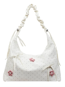 Chic floral tote bag with red checkered flowers and ruffled strap on white background