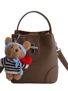 Brown litchi pattern bucket bag with metal lock and cute teddy bear charm