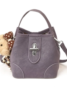 Purple faux leather bucket bag with silver twist lock and cute plush bear charm