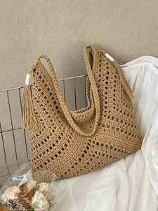 Bohemian oversized hand-woven straw beach tote bag with fringe details and hollow pattern