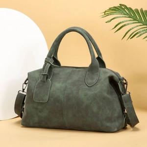 Deep green Boston handbag in matte leather finish with dual handles and long shoulder strap