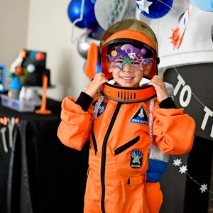 Kids orange astronaut costume set with NASA patches and space explorer helmet for party
